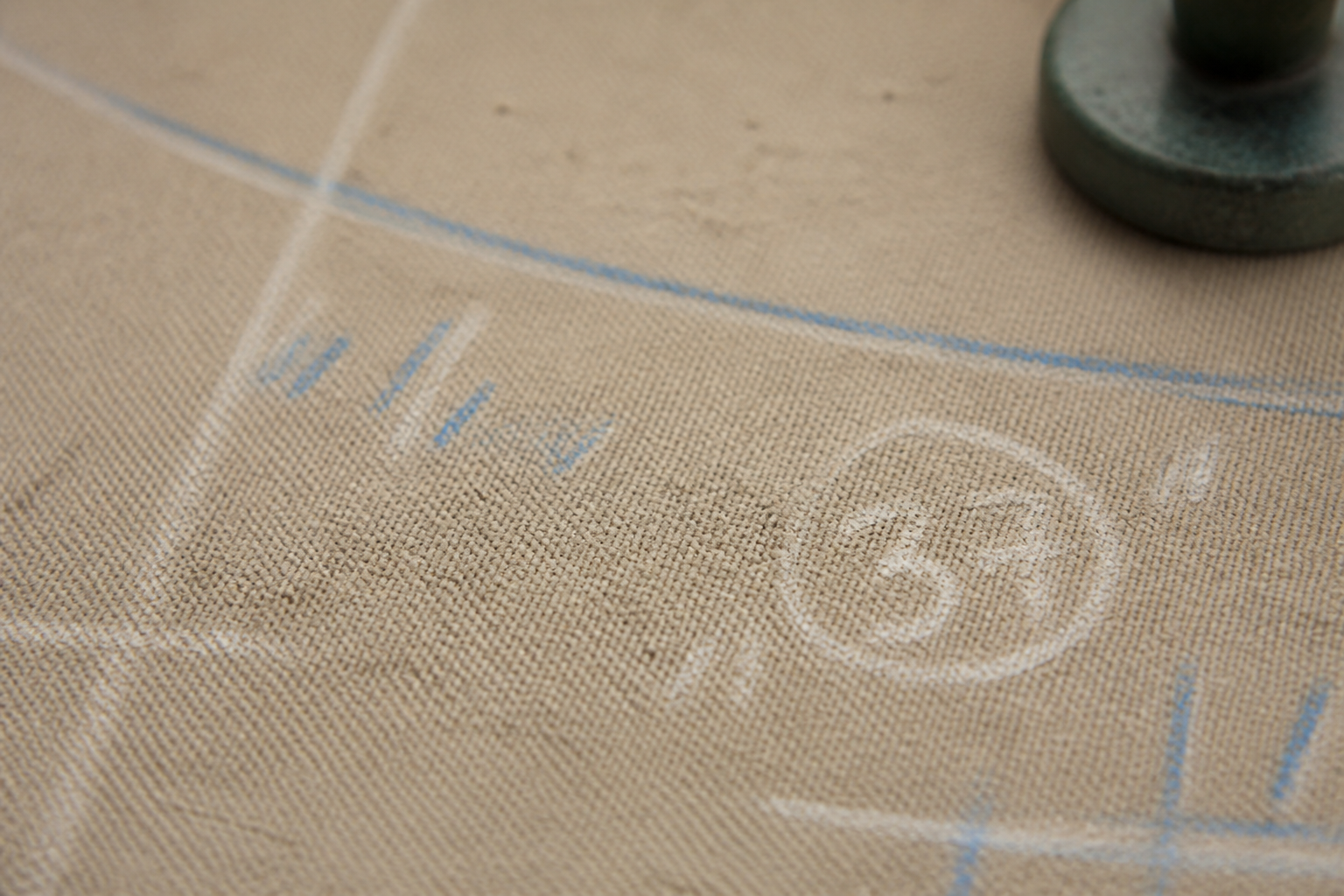 Chalk marks on canvas representing proportion reading in personal services